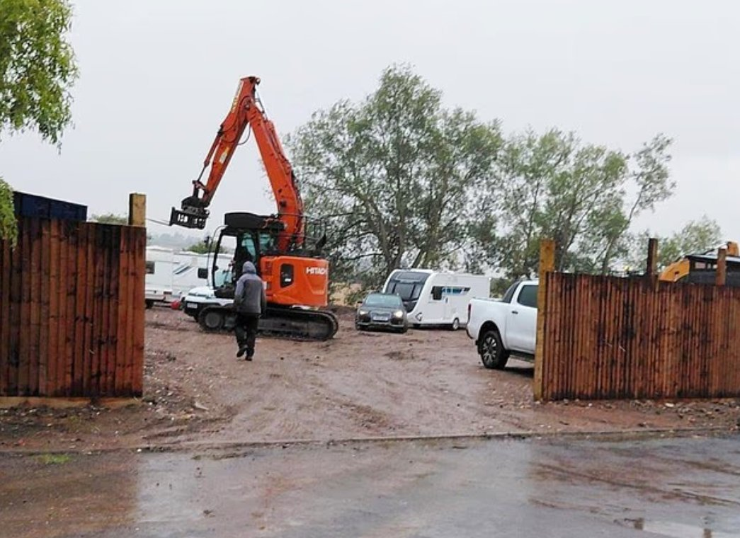 A 10ft wooden fence was erected within 24 hours of bulldozers breaking ground on the protected greenbelt plot, which had been listed for sale at up to £100,000.