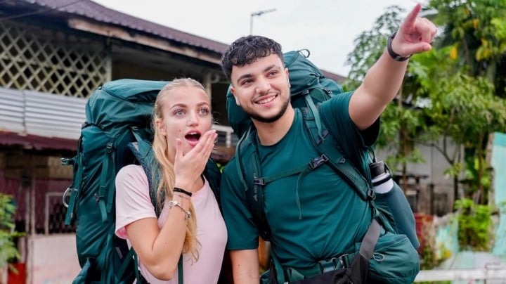 Junior Andre, 21, and his sister Princess, 19, on a night bus — the pair were the only contestants yet to spend money on taxis despite falling to last place.