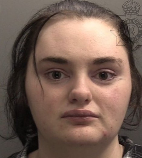 Courtney Clapham, who pleaded guilty to three counts of perverting the course of justice at Grimsby Crown Court, seen here in a Humberside Police custody photograph after her arrest.