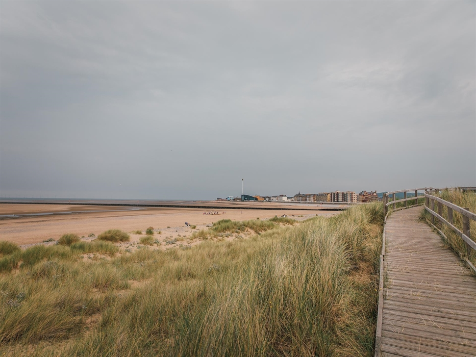 Police are investigating the 'unexpected' death of a woman whose body was found on Rhyl beach in North Wales