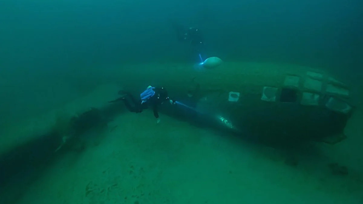 Looking at the editor's caption label "Superfortress Has, Years Underwater, Now It" — these are fragments of the headline, not personal names.