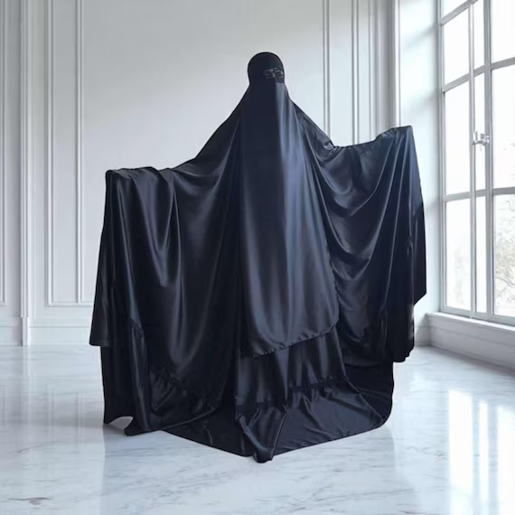 A woman wearing a burqa, the full-body covering Nick Timothy compared to a "ball and chain" that deliberately cuts women off from society and damages social trust in wider communities.
