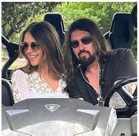 Elizabeth Hurley, 61, is reportedly 'engaged to Billy Ray Cyrus' after flashing a diamond ring in a bathrobe selfie