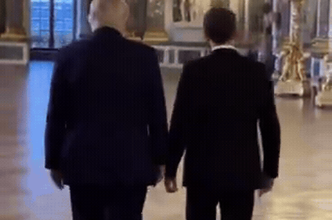 Donald Trump and Emmanuel Macron, as Trump claimed some migrants in France "hate the buildings, hate the art, hate the people.