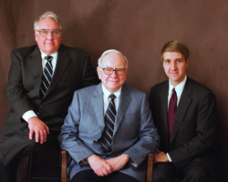 Warren Buffett and his son Howard Buffett, who will succeed him as Berkshire Hathaway's chairman, with Howard's own son.