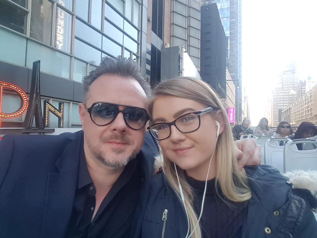 David Doyle, from Weston-super-Mare, enjoying an open-top bus tour, whose fiancée, children and nephew said his life was cut short "just as life started to look up for him".