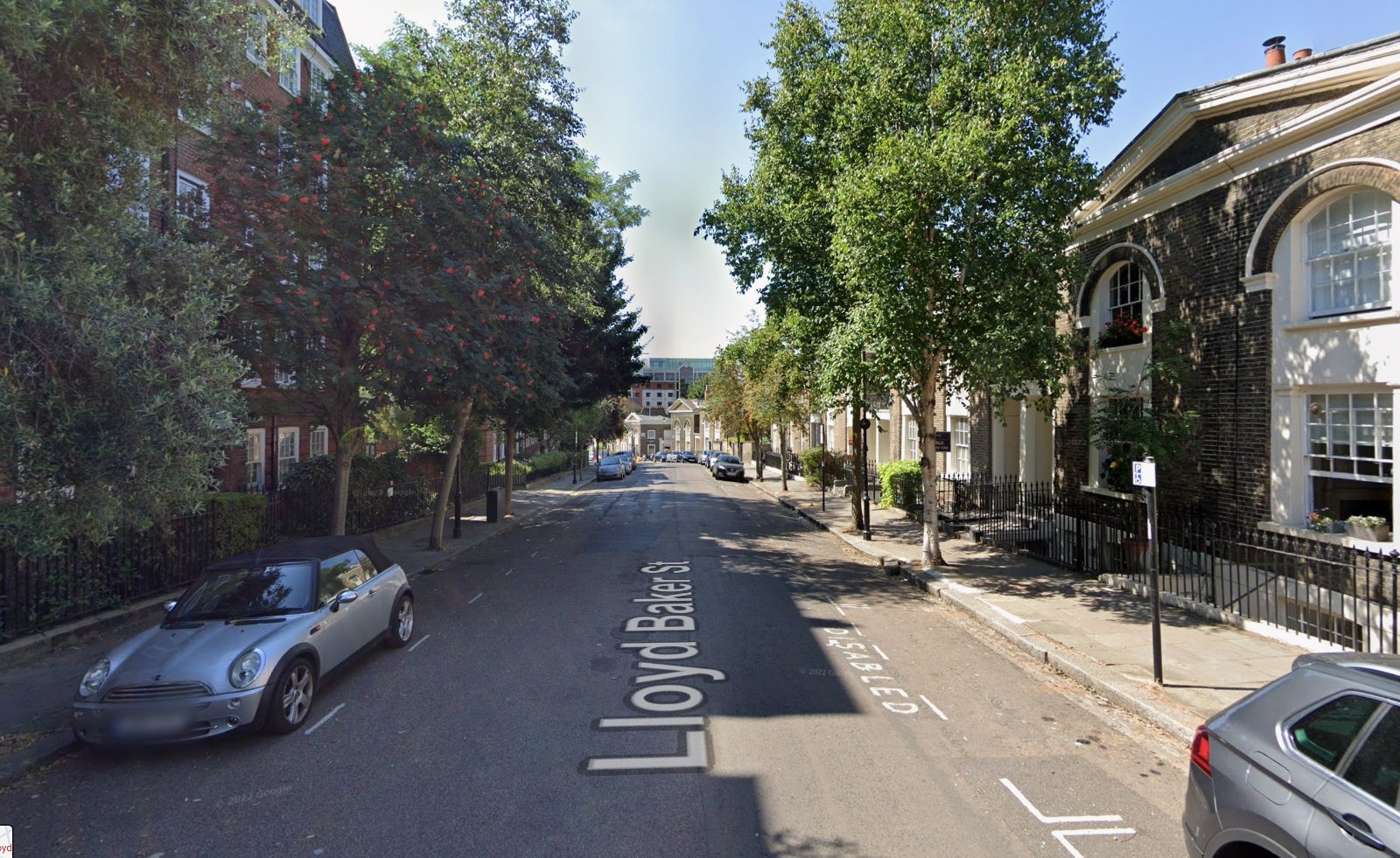 Lloyd Baker Street in Clerkenwell, Islington, where floral tributes, candles and balloons have been tied to railings after a 28-year-old man was stabbed to death nearby on Wednesday night.