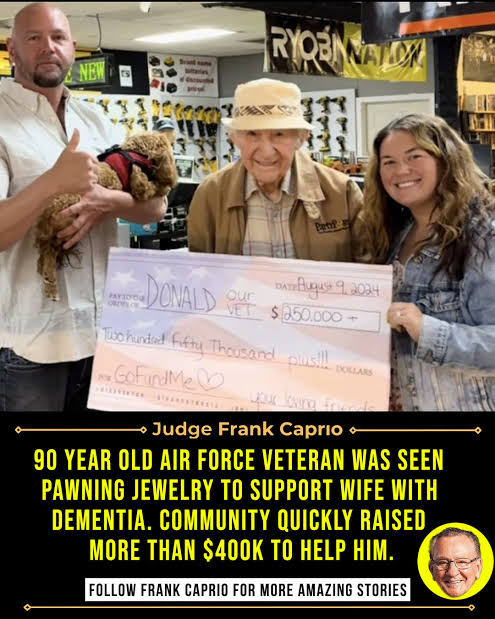 A $250,000 GoFundMe cheque held by Donald Johnson, whose original $745,000 campaign was shut down after daughter Amy admitted using a fake identity to launch it.