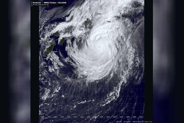 Typhoon Dujuan, seen sliding east of Japan, has driven evacuation orders for nearly two million people while burying the Izu Islands under more than 700mm of rain.