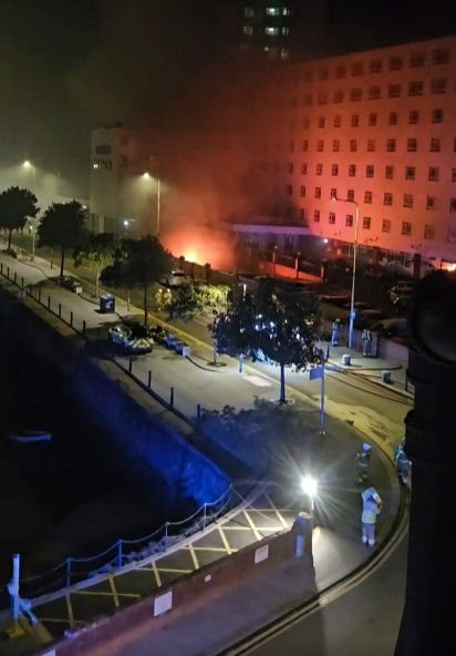 Fire burning at the Grand Burstin Hotel on Folkestone seafront, where more than 200 guests were forced into freezing temperatures after a blaze broke out in the basement shortly after 1am.