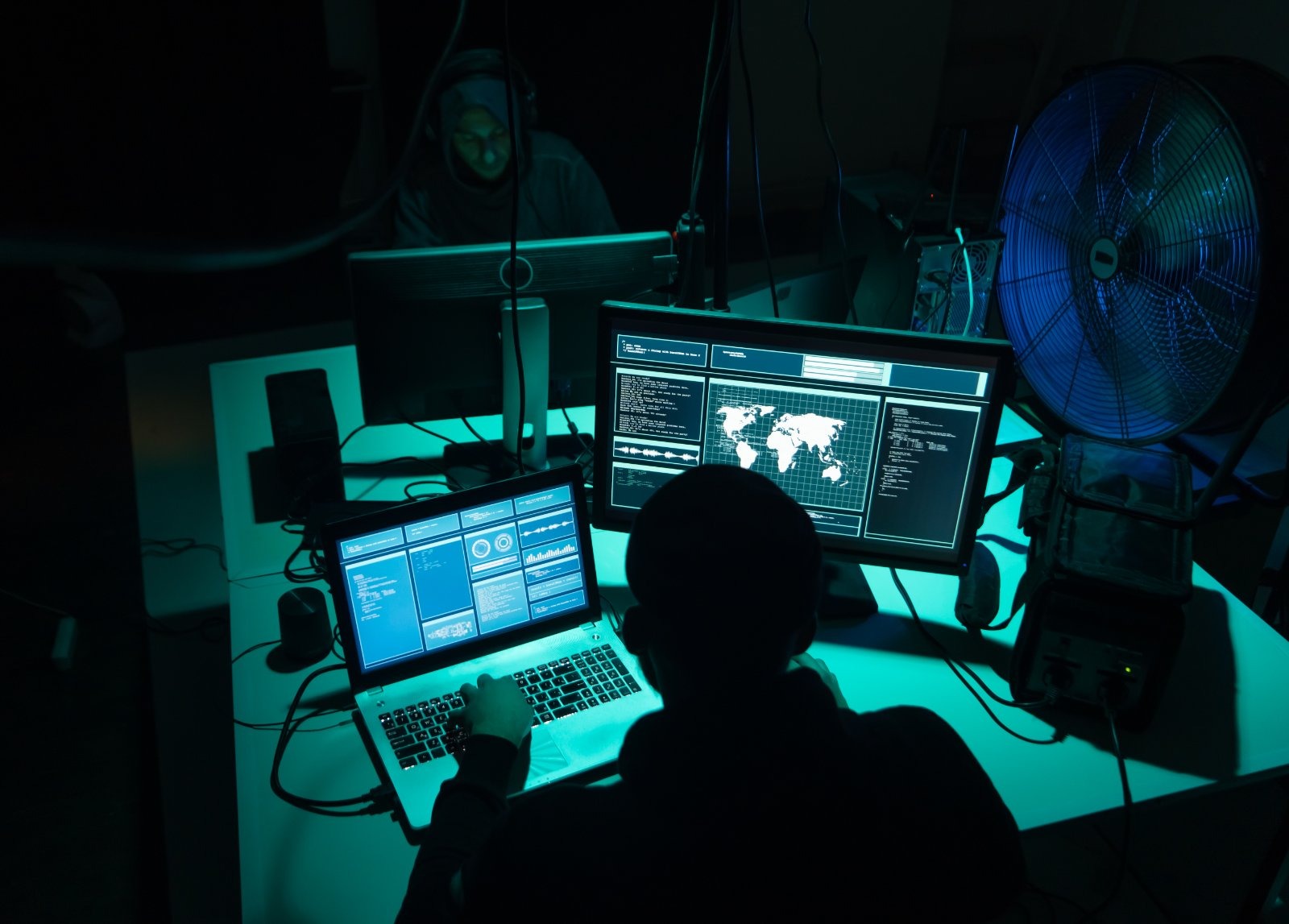 Computer hackers, in a generic stock image. The FCA announced today that 238,396 suspected money mule accounts were shut in 2025, with Steve Smart warning that moving funds at another's request risks prosecution.