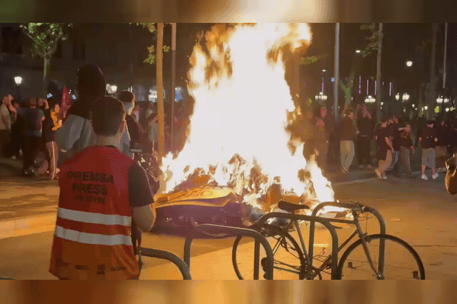 Barcelona's streets in the aftermath of a mass housing protest, where almost 30 officers were injured and 13 people arrested — including a juvenile — during overnight clashes.