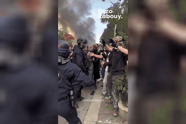 Bally Bagayoko amid the Paris demonstration, as France's student unrest reached what the High School Students Union called "a new record" turnout, with a baby hospitalised after being struck by a firework.