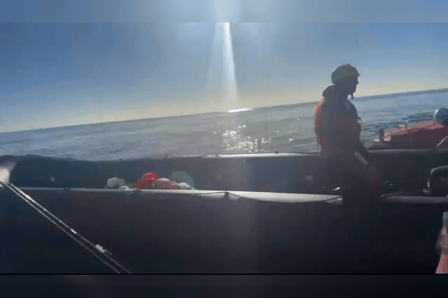 Rescue crew aboard a rigid inflatable vessel respond to a deflating migrant dinghy in the English Channel, the scene of the alleged attack for which Daniel Thomas was refused bail today, with trial set for 1 March 2027.