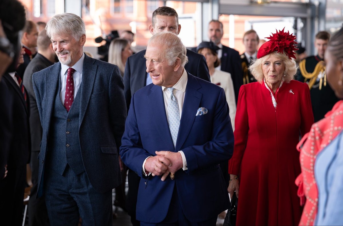 King Charles (centre) and Queen Camilla with a Senedd official — Charles also met Noah Jones, 10, whose great-grandfather helped save children's lives during the 1966 Aberfan disaster.