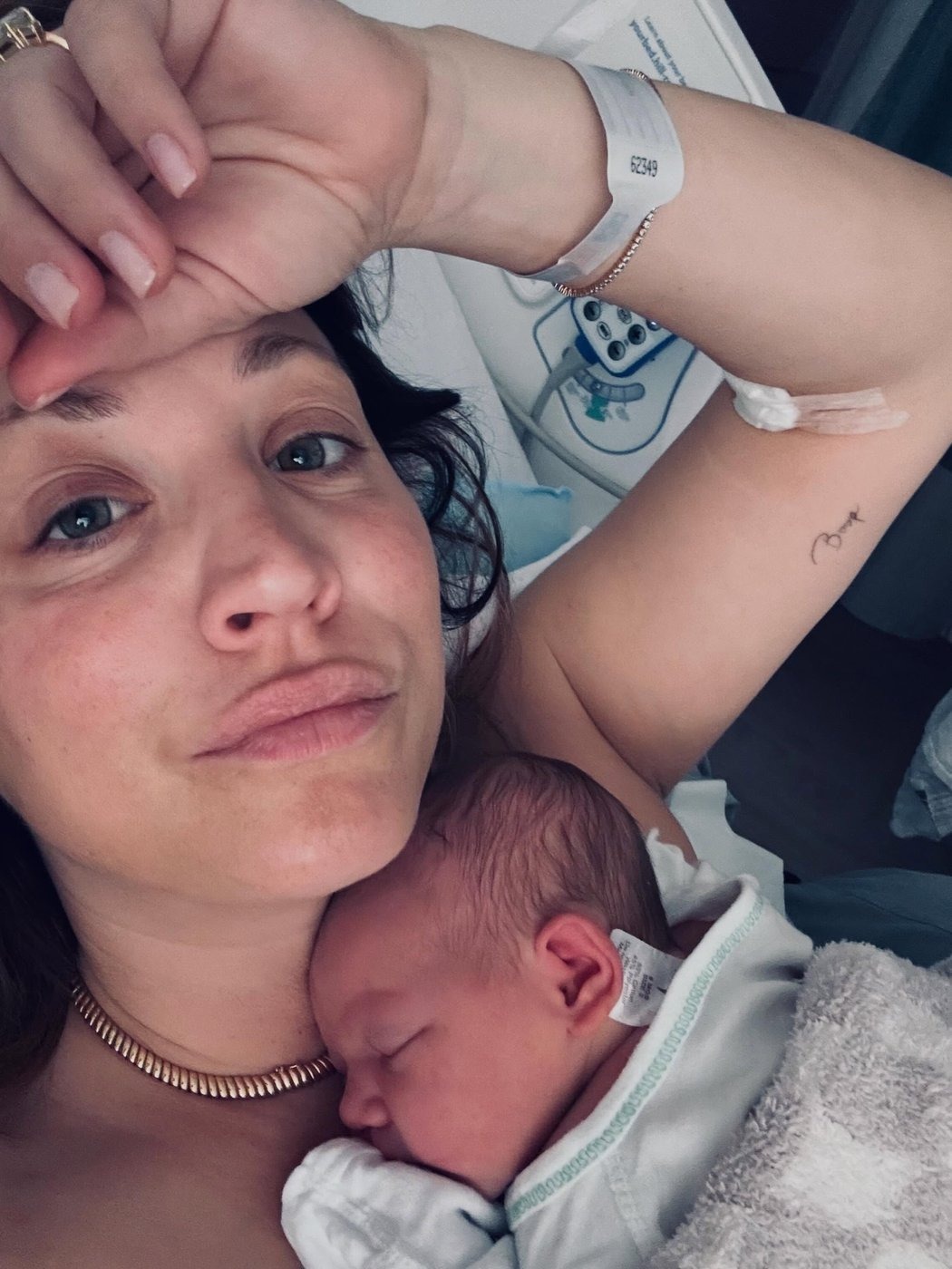 Kaley Cuoco with her newborn daughter Philomena Carmine Bobby Pelphrey in a hospital selfie; Pelphrey called Cuoco a "champion" throughout a pregnancy she revealed in June with a pink-cake gender reveal.
