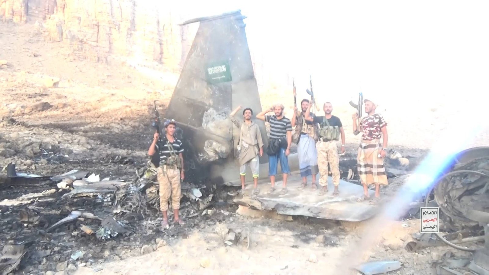 Houthi fighters pose beside the wreckage of what the group claims is a downed Saudi aircraft, as Saudi Arabia's appeal to Beijing has prompted China to press Tehran to curb the militia's escalating campaign.