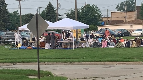 Muslim worshippers at outdoor prayers in Warren, Michigan, one of five mosques now operating within a few miles of longtime resident Justin Tye's home.