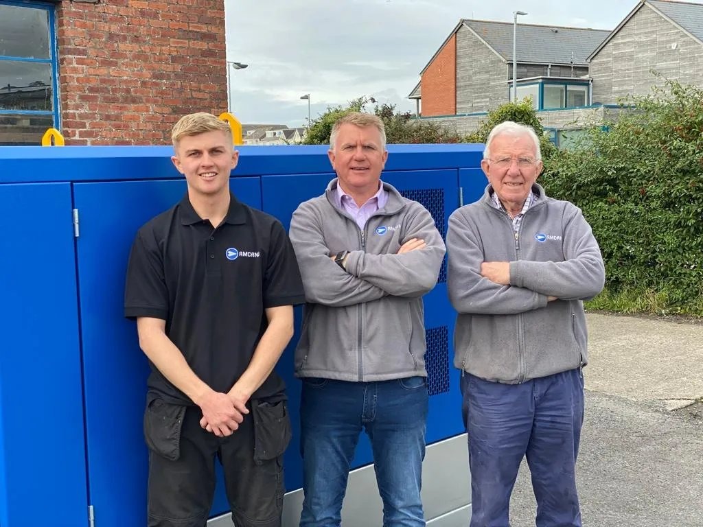 Owain Davies pictured with his son Aron, who said the family had "suffered an unimaginable loss", and his father Spencer, who founded Amcanu in Burry Port in 1975.