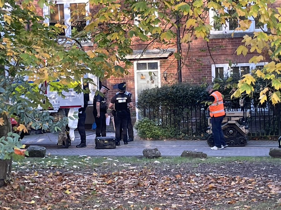 Essex Police officers at the door of an address in Sawyers Grove, Brentwood, where a 100-metre cordon was established after specialists were called to assess a small number of items found inside following the arrest of…