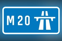 The M20 motorway sign, where a section near Ashford remains closed after an early-hours single-vehicle crash sparked a car fire, leaving freight for Dover diverted via the A2 and M2.