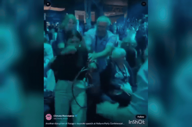 A protester is grabbed and struck during the ejection of activists at Nigel Farage's Reform UK conference speech, after which West Midlands Police issued a conditional caution — an admission of guilt — to one man…