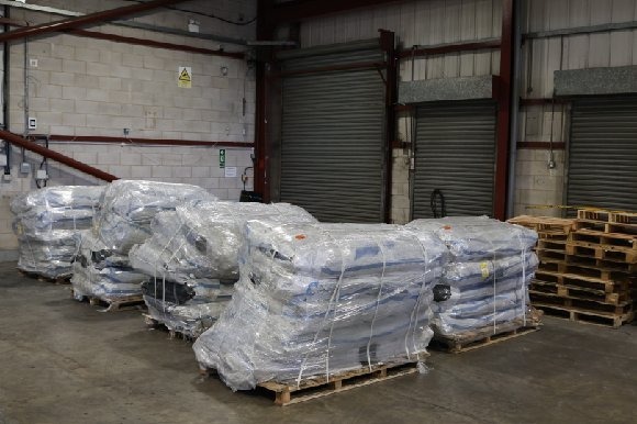 Pallets of shrink-wrapped inflatable boats intercepted at East Midlands Airport — the first large seizure of small-boat equipment ever caught arriving in the UK by air freight.