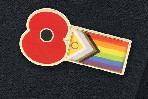 The Royal British Legion's Poppy Pride badge, which the charity says honours LGBTQ+ service personnel who faced discrimination under the military ban on gay personnel lifted in 2000.