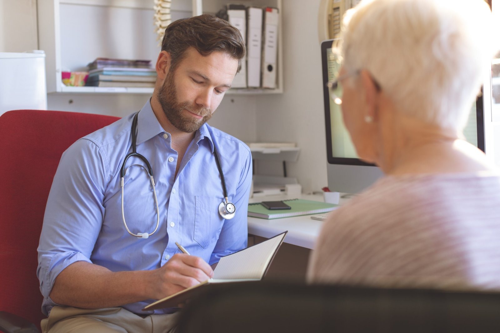 A GP consulting with a patient. Labour's NHS reforms risk closing village surgeries, with rural communities facing higher costs to access care, a report warns.