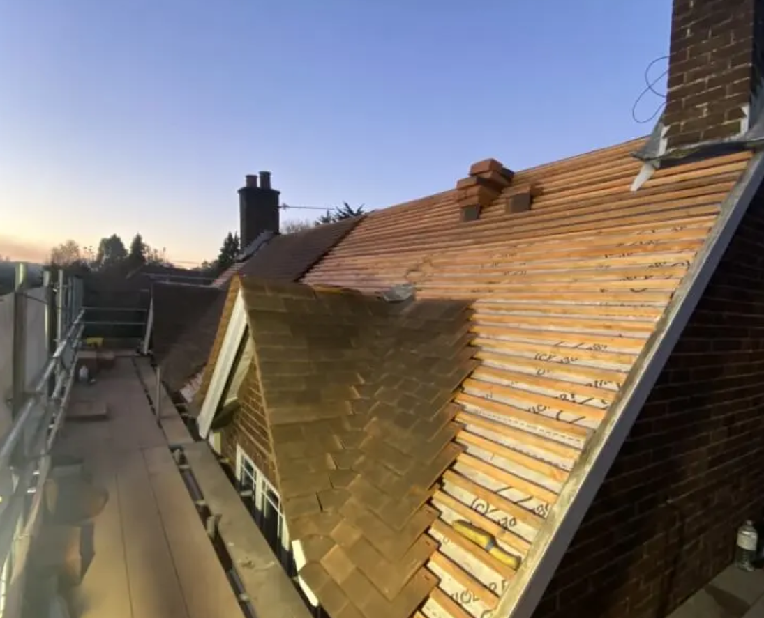 A residential roof stripped back for repair work of the kind Citizens Advice warns fraudsters fabricate faults on, with one in four roofing complaints now suspected to involve fraud.