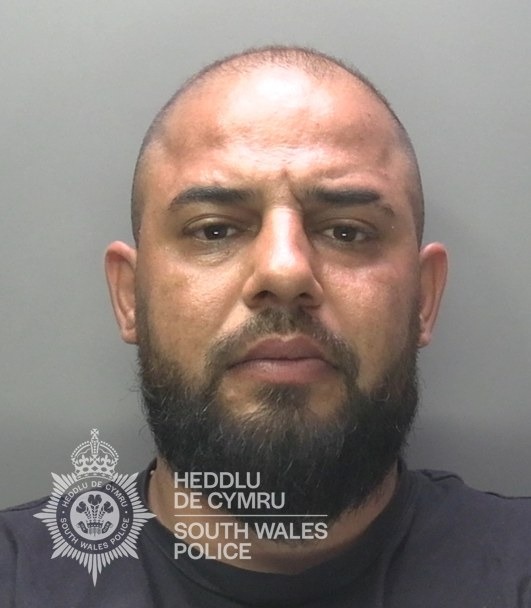 David Novac, who also used the names Teodor and Ahmed, in a South Wales Police custody photograph after pleading guilty to voyeurism.