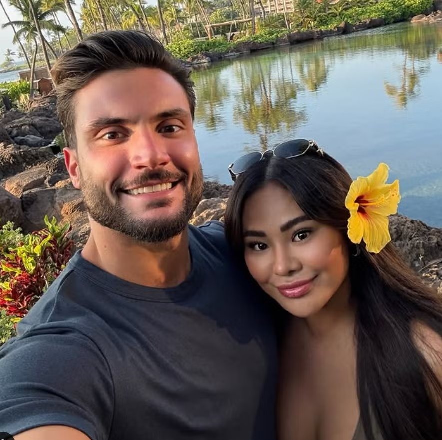 Iris Au and Adam Iza in a selfie photograph. Au was sentenced to 18 months after hiding more than $2.6 million in illicit funds — money prosecutors linked to Iza — from the IRS between 2020 and 2023.