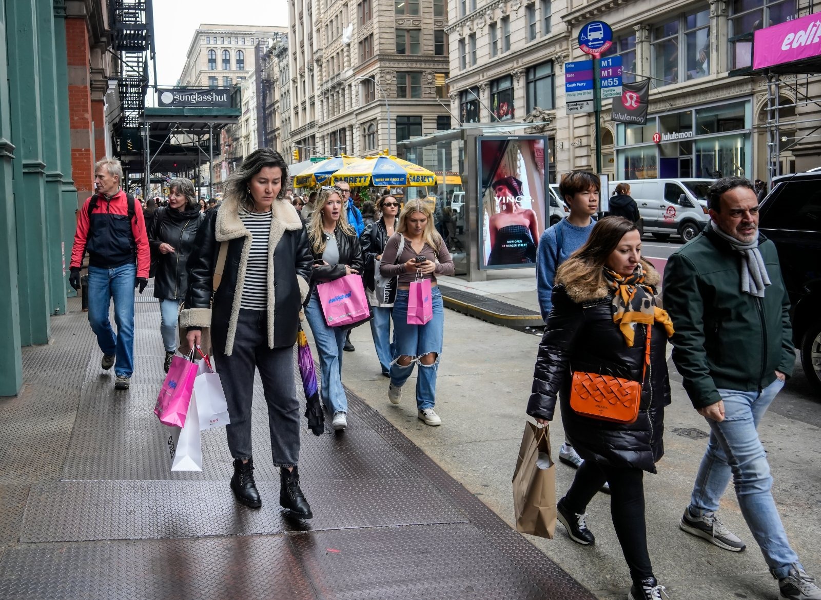 Shoppers on a UK high street, as figures show non-food sales grew just 0.3% in September, with clothing and footwear hit hardest by unseasonably warm weather.