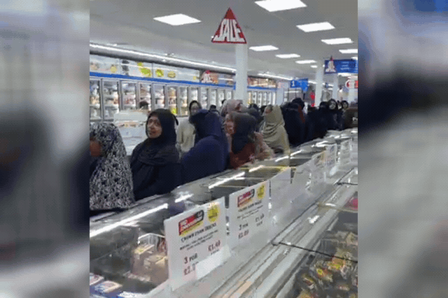 Shoppers crowding inside Masala Bazaar in Romford, where a cooking oil giveaway on the store's third anniversary saw customers divide spontaneously into single-sex queues.