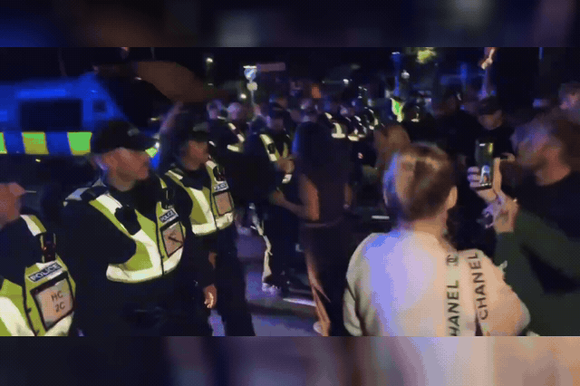 Police officers confronting a crowd in Gosport, where six protesters were arrested as authorities abandoned plans to land around 60 migrants at Haslar Marina, diverting them to Dover instead.