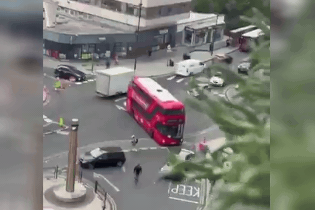 A double-decker H98 bus sits embedded in the facade of Trident House apartment block on Station Road in Hayes, west London, after Friday's crash.