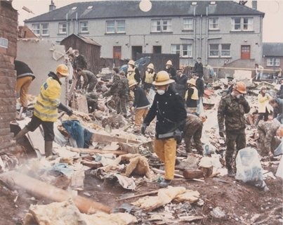 Responders search Rosebank in Lockerbie, Scotland, after the 1988 bombing — an attack Abu Agila Mohammad Mas'ud is accused of carrying out, with his trial now delayed to January as he seeks dismissal over his alleged…