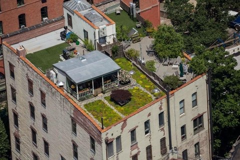 The rooftop cottage and green roof atop the Greenwich Street co-op in Manhattan's West Village. Developer David Puchkoff had soil blown up through a tube to create the meadow garden, with the 3,060-square-foot penthouse…