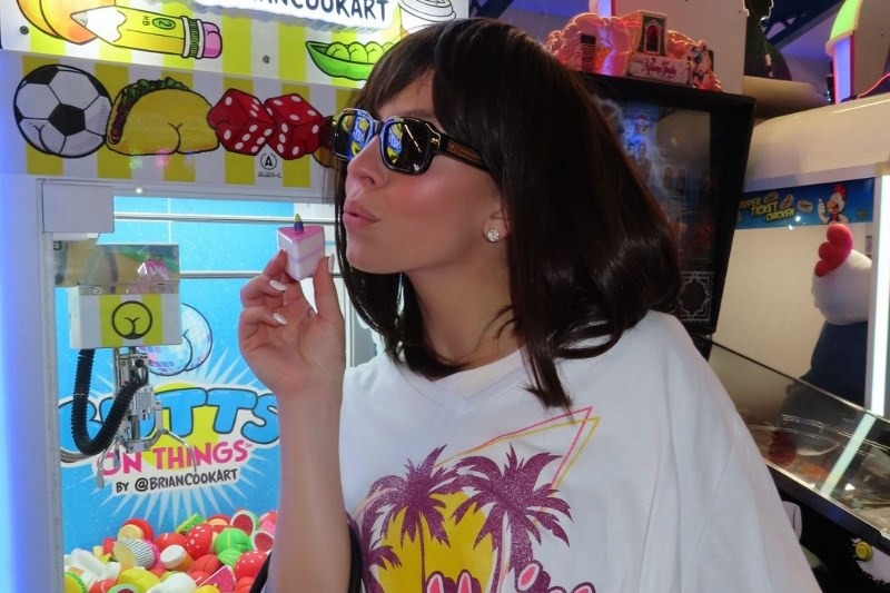 Sydney Sweeney, who posted the outing to Instagram with the caption "When ur bestie shows up and says 'here put this wig on'," rode attractions and ate chicken tenders at Pacific Park.