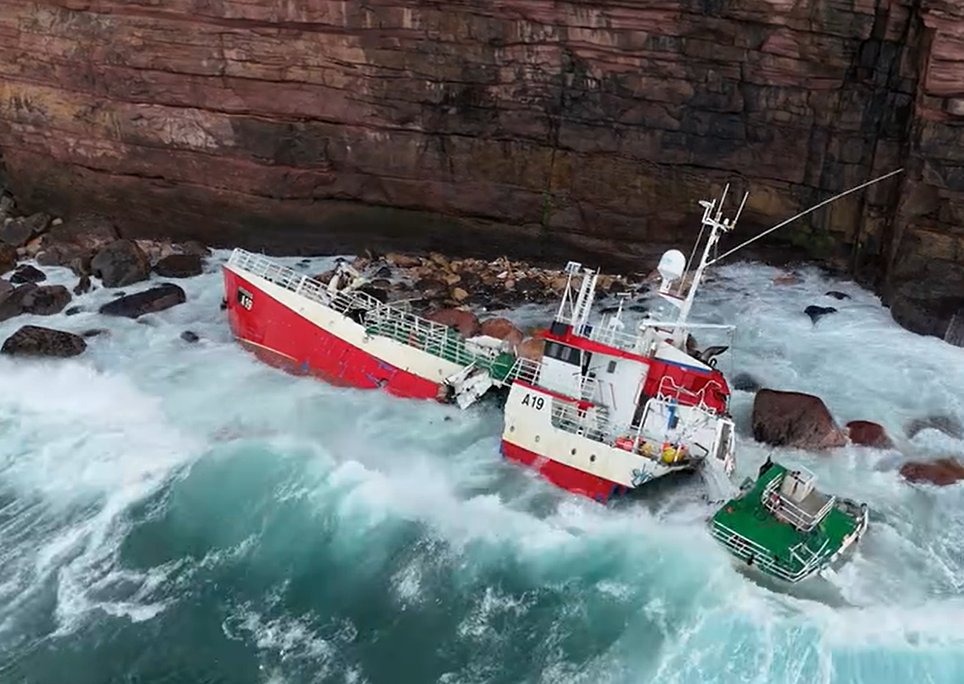 The fishing vessel Genesis, breaking apart on Orkney rocks, was rescued from by coastguard helicopters that winched all 17 crew members to safety, including four Spanish fishermen and several Indonesians.