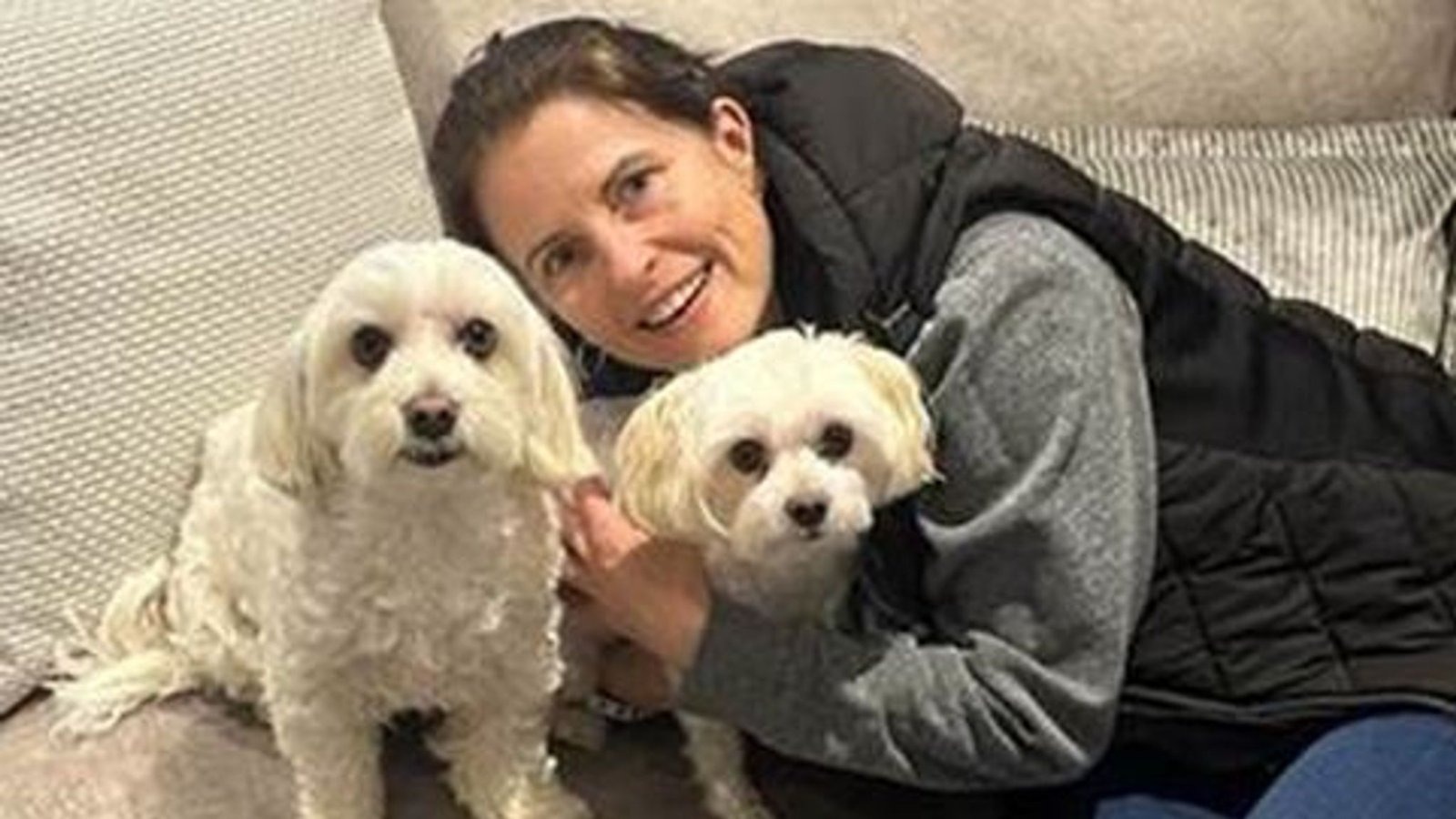 Marie Theobald with her two Maltese dogs Riley and Honey, whom relatives remembered as "honest, hardworking, selfless," adding: "May they all rest in perfect peace together.