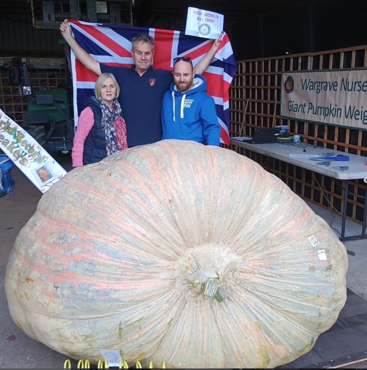 Ian Paton displays his record-breaking 2,856.8lb pumpkin — grown solo for the first time, without his twin brother Stuart, who retired to travel the world this year.