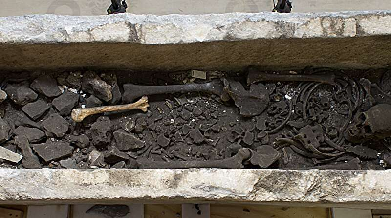 Human skeletal remains inside the open Roman sarcophagus at Westminster Abbey, carbon-dated to between 987 and 1052, which experts believe belonged to a middle-aged man of about 5ft 9in who suffered from gout.