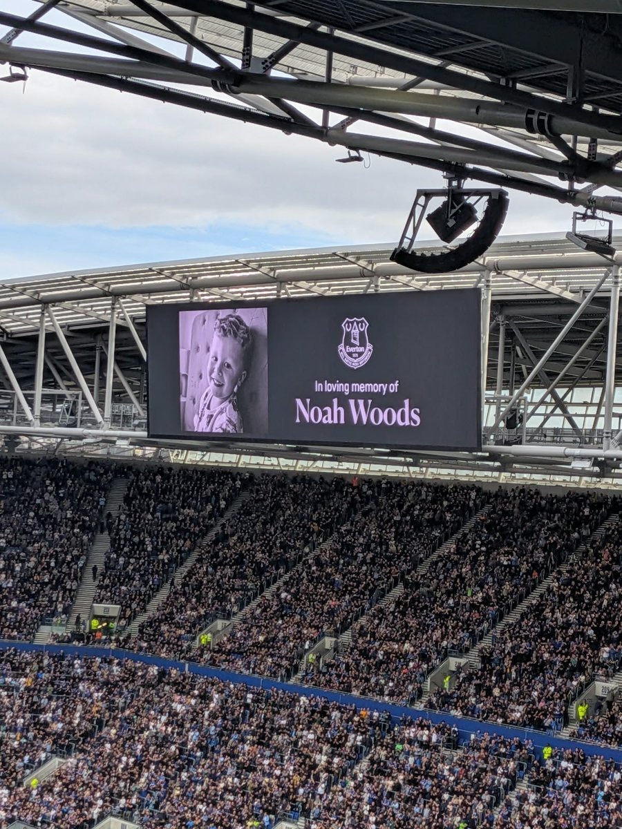 A big screen at Everton's stadium displays a tribute to Noah Woods, whose father Rhys Woods wrote: 'There are no words to describe the pain of this loss — he was the sweetest and most innocent little boy.'