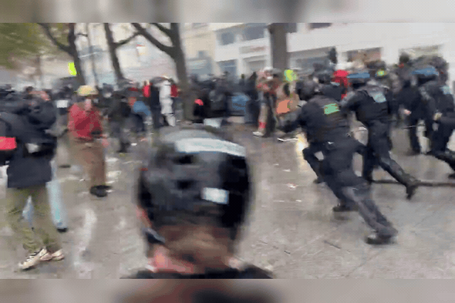 Clashes between protesters and riot police in Paris, as largely peaceful nationwide marches turned violent by evening despite a 70,000-strong deployment that prevented the arson seen a week earlier.
