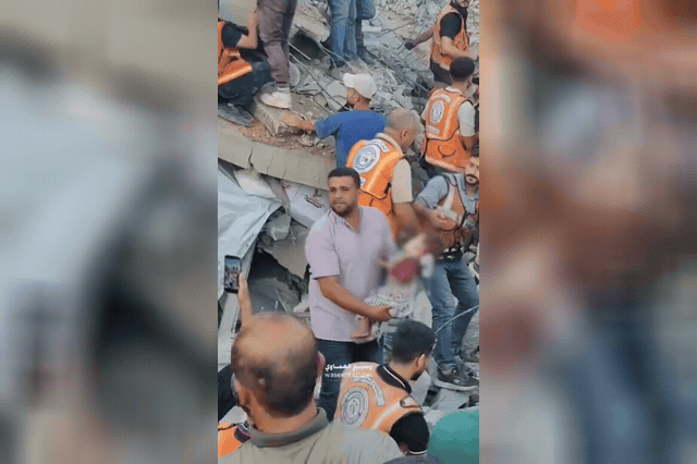 Rescue workers and civilians pick through rubble in Gaza City after a war-damaged apartment block collapsed overnight, killing at least 21 people, with nearly 100 more believed still trapped beneath the wreckage.