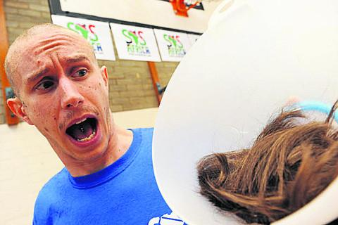 Mark Fletcher, shown after a charity head-shave in 2012, was later found by a Teaching Regulation Agency panel to have groomed a sixth-form pupil through late-night emails sent as late as 4:04am.
