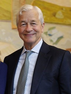 Jamie Dimon cautioned that "large fiscal deficits, sticky inflation and rising interest rates continue to shift under the surface," even as JPMorgan Chase posted a rare per-share miss of $5.57 against a $5.90 consensus.