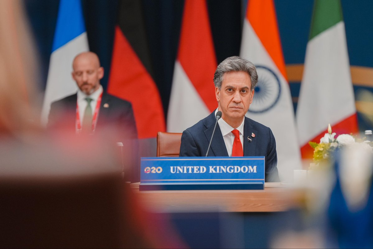 Ed Miliband at the United Kingdom nameplate during the G20 Foreign Ministers' meeting in Atlanta, where Ukraine was not invited despite having attended similar gatherings in previous years.