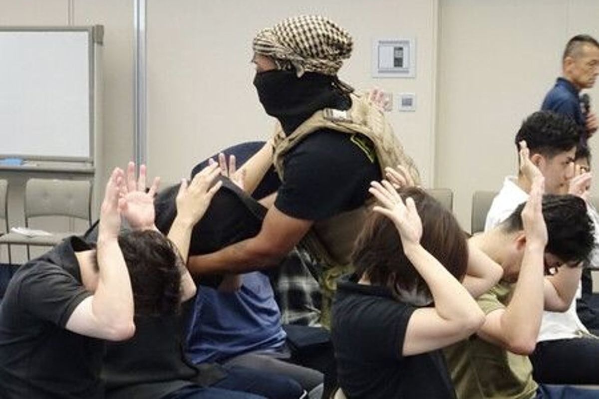 Actors in costumes evoking a traditional Arab keffiyeh take part in an anti-terror drill that Japan's foreign ministry has since distanced itself from, removing photographs after critics said the outfits reinforced…